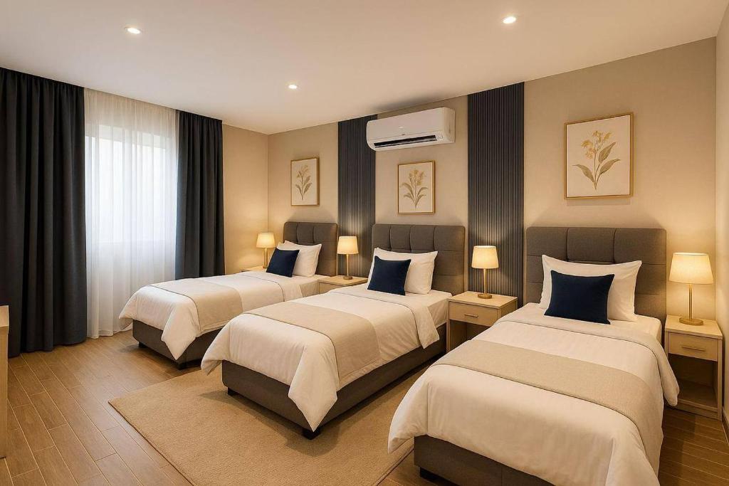 Giường trong phòng chung tại pyramids heaven hotel- فندق جنة الاهرامات