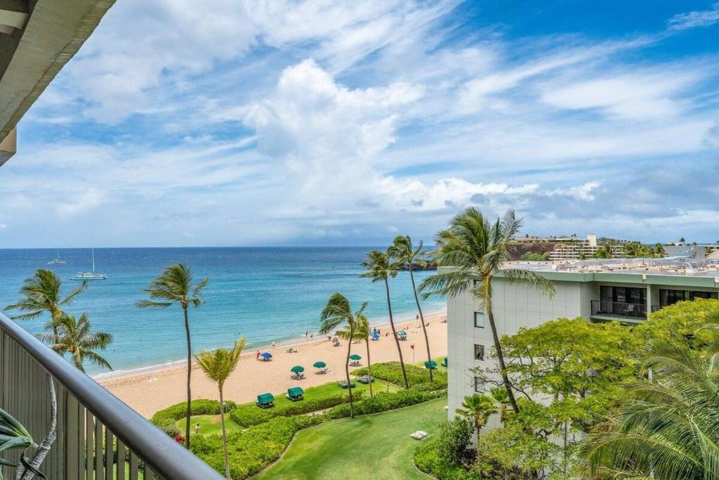 a view of the beach from the balcony of a condo at Whaler 712 in Lahaina