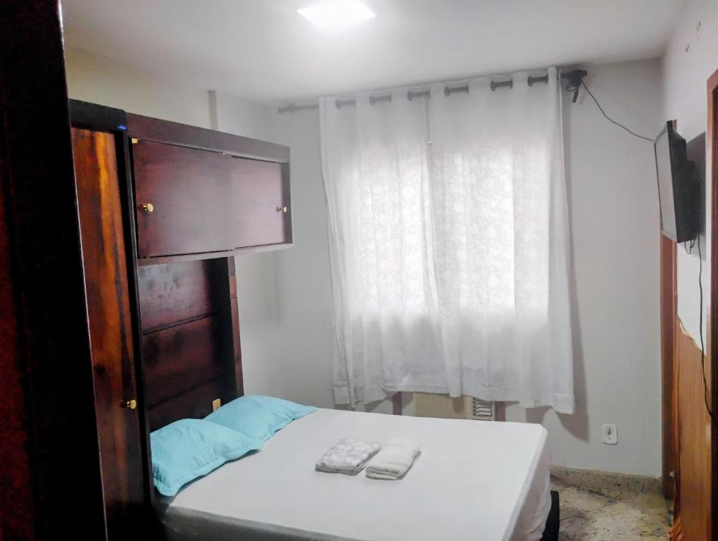 Postel nebo postele na pokoji v ubytování Flat Aconchegante e Tranquilo