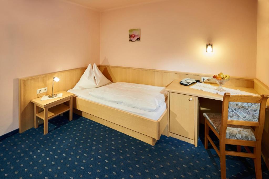Postel nebo postele na pokoji v ubytování Hotel-Restaurant Schwaiger***