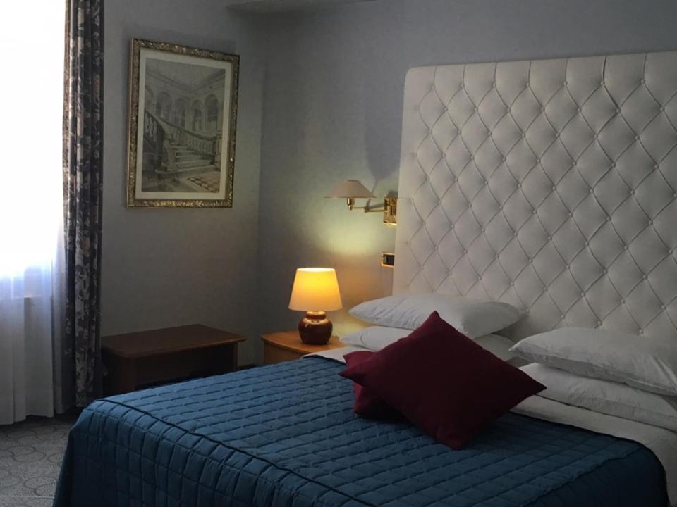 Postel nebo postele na pokoji v ubytování Hotel Gioia Garden