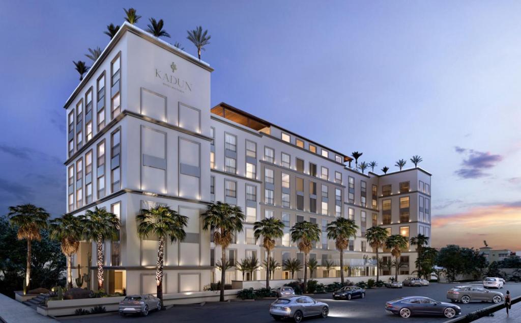 a rendering of a hotel with cars parked in a parking lot at Kadun Hotel Boutique in Cabo San Lucas