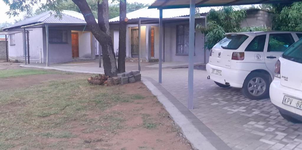a white van parked in front of a house at Nuday Guesthouse in Vaalwater