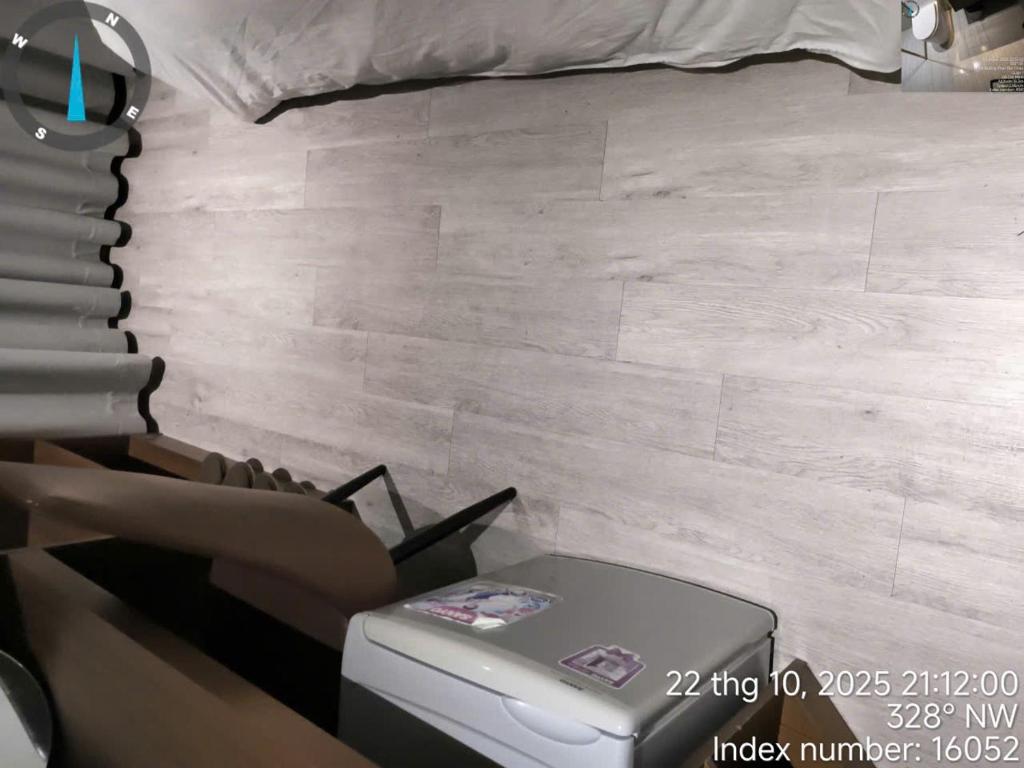 Giường trong phòng chung tại Coco Hotel