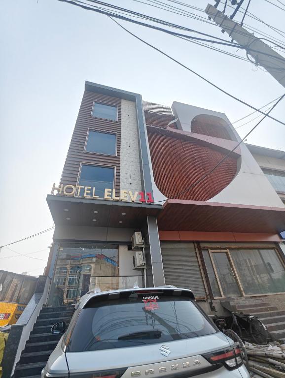a car parked in front of a building at Hotel Elev11 in Zirakpur