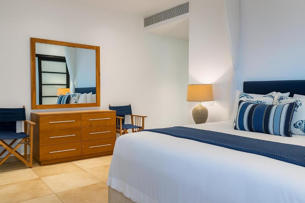 Ένα ή περισσότερα κρεβάτια σε δωμάτιο στο Fairview Signature Suites