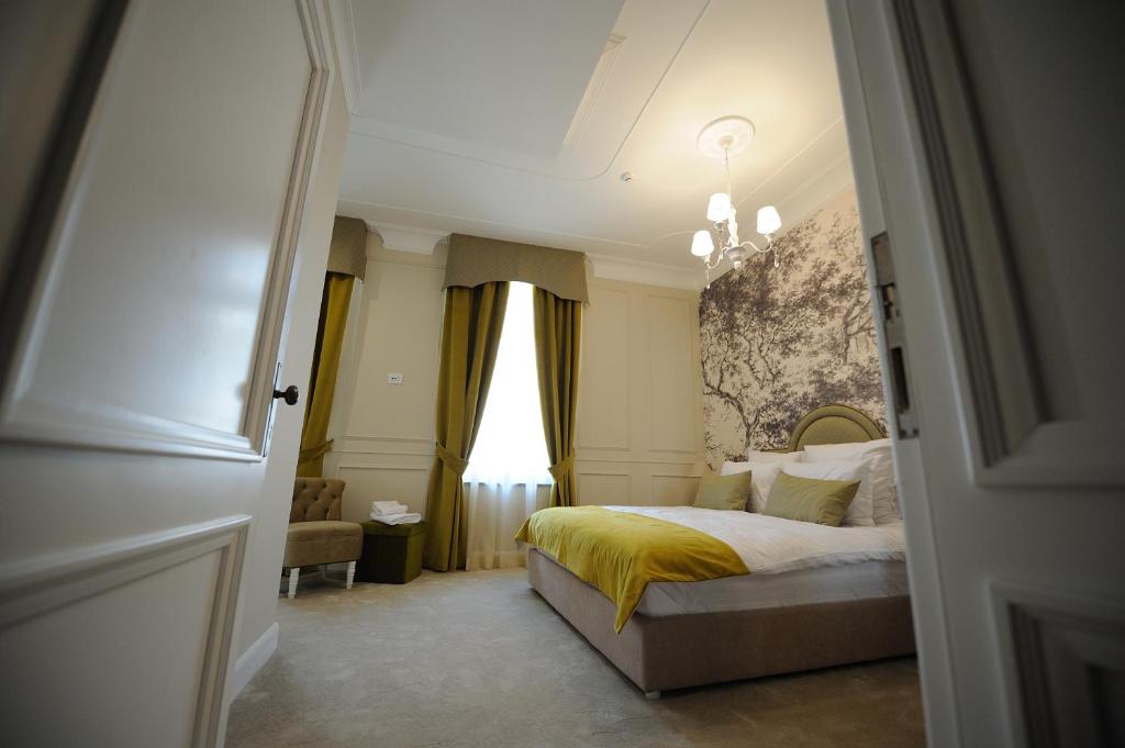 Postel nebo postele na pokoji v ubytování Hotel Splendid 1900