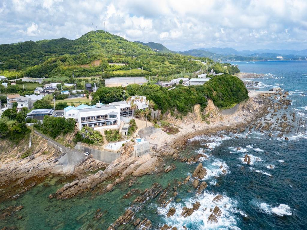 an aerial view of an island in the ocean at MAX CUBE Inami Seafront in Inami