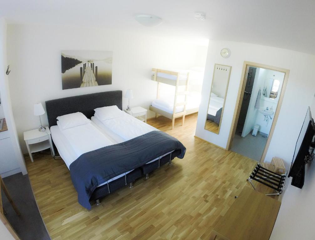Postel nebo postele na pokoji v ubytování South Central Apartments