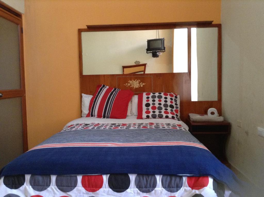 Postel nebo postele na pokoji v ubytování Hostal Buenos Aires