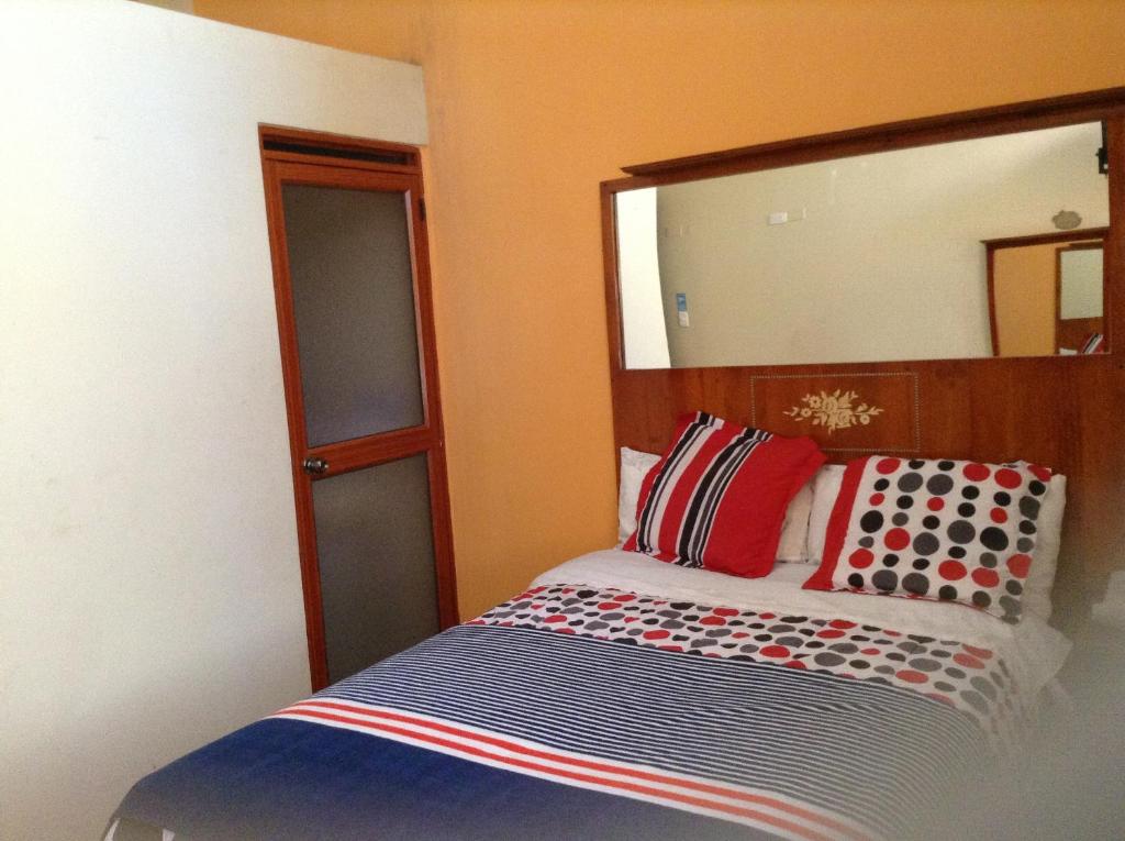 Postel nebo postele na pokoji v ubytování Hostal Buenos Aires
