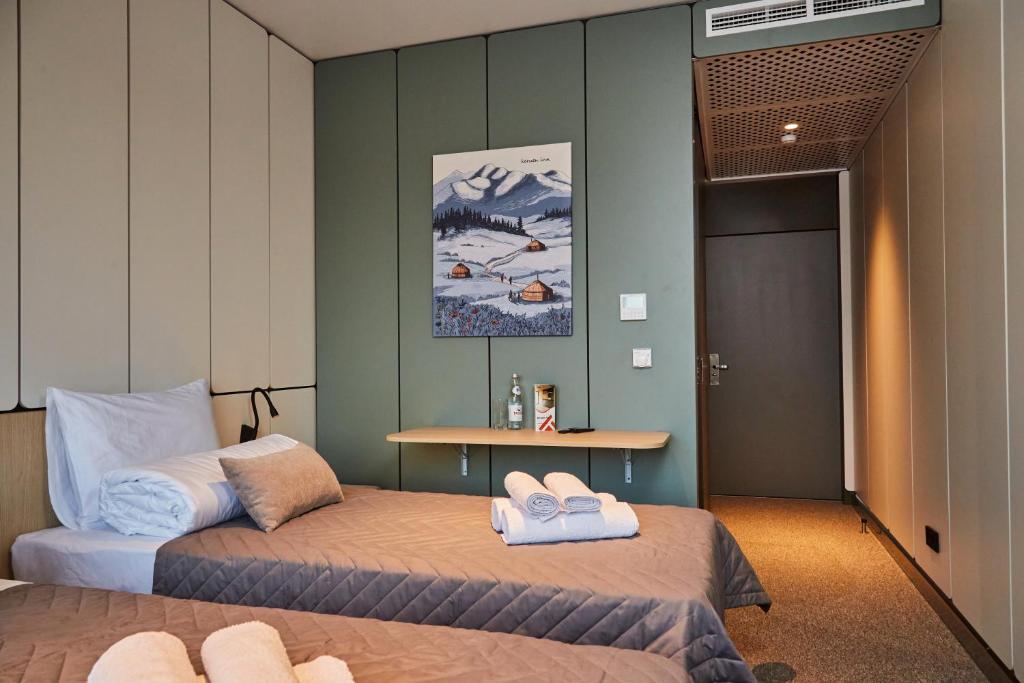 Ένα ή περισσότερα κρεβάτια σε δωμάτιο στο Keruen inn Aral