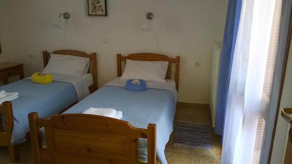 Postel nebo postele na pokoji v ubytování House of Polymnia