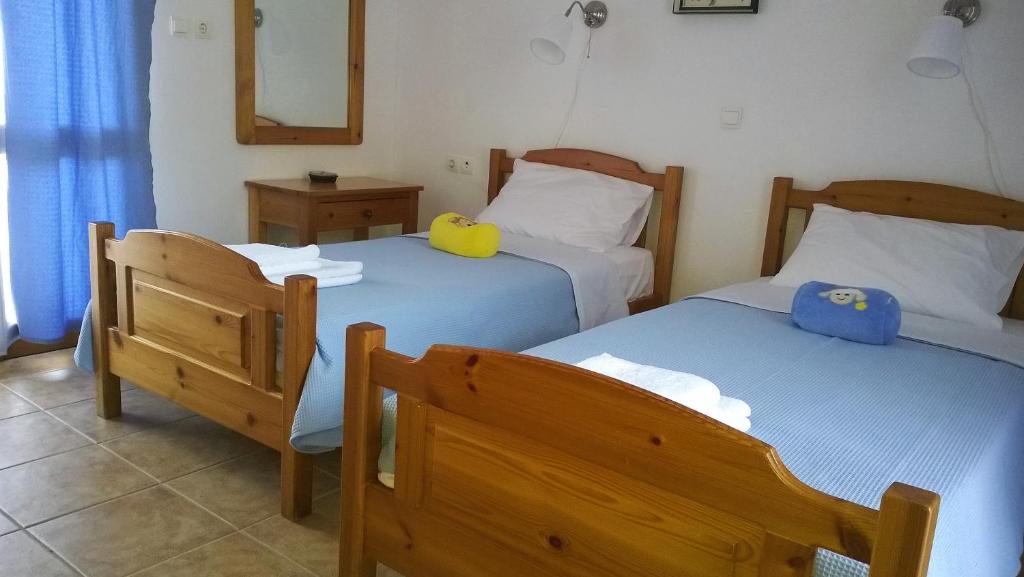 Postel nebo postele na pokoji v ubytování House of Polymnia