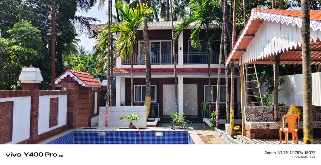 a house under construction with a pool in front of it at Sai Holliday's home in Alibaug