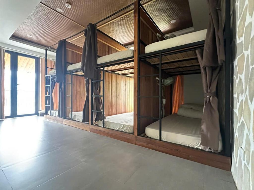 a room with four bunk beds in it at Jashill Homestay in Yên Minh