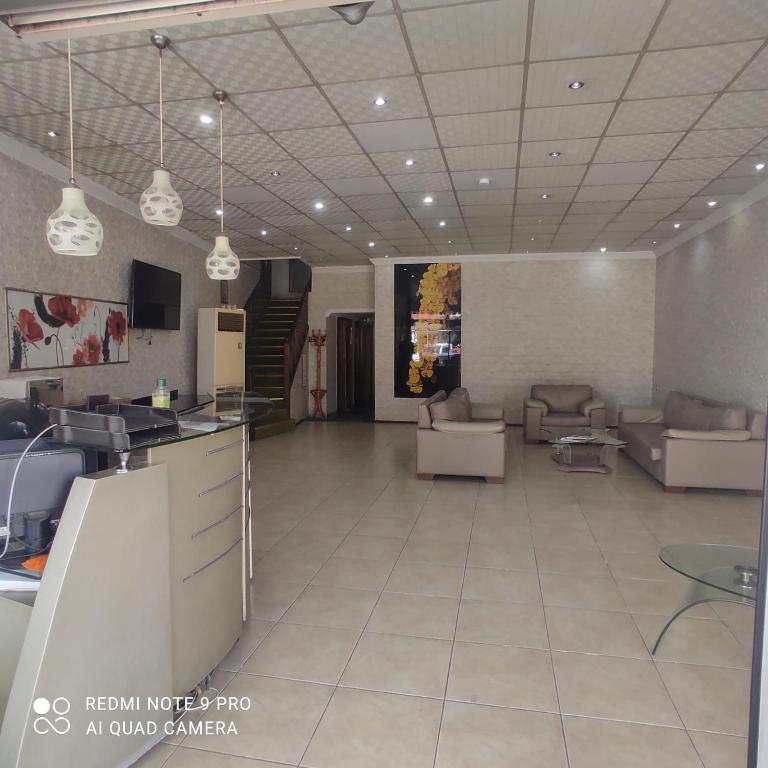 a large room with couches and a living room at Evim Butik Otel in Seyhan