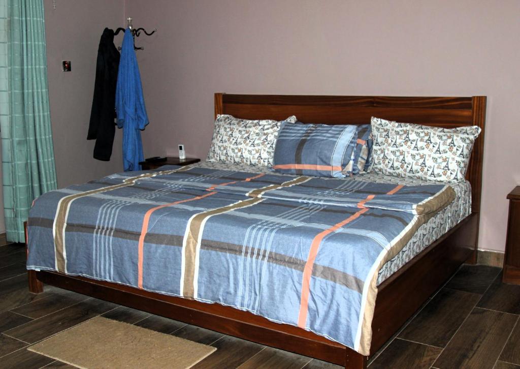 Postel nebo postele na pokoji v ubytování Villagers Team Hospitability