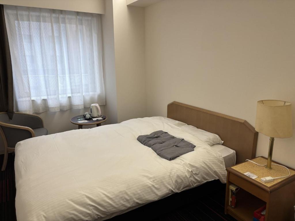 Postel nebo postele na pokoji v ubytování Hotel Tetora Spirit Sapporo - Vacation STAY 59351v