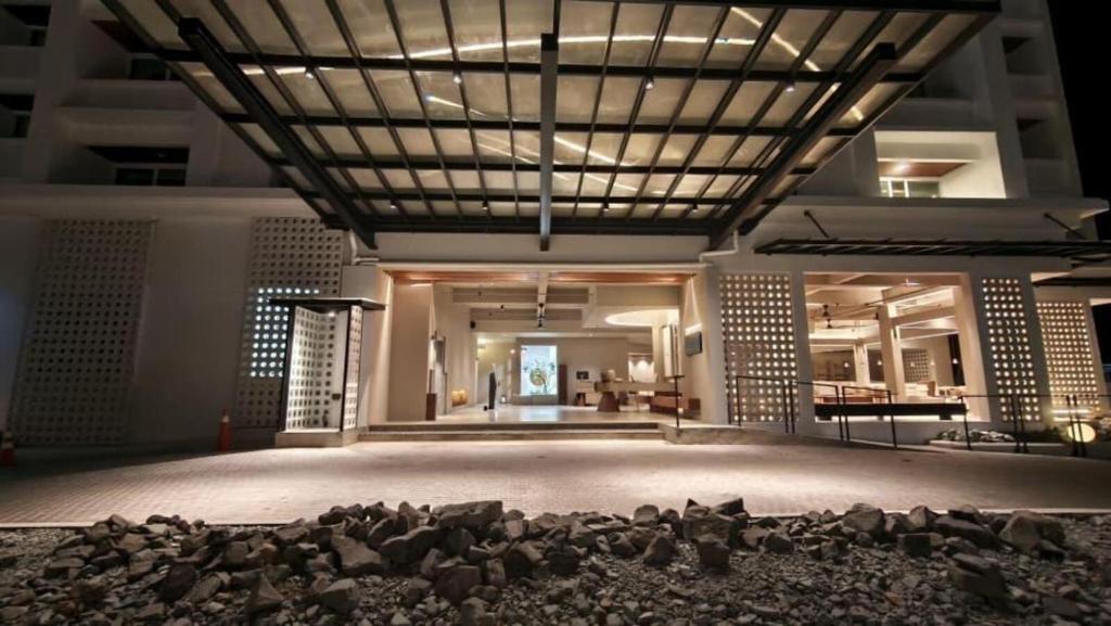 a large room with a stage with rocks on the floor at Blanco Apartment Hotel in Bintulu