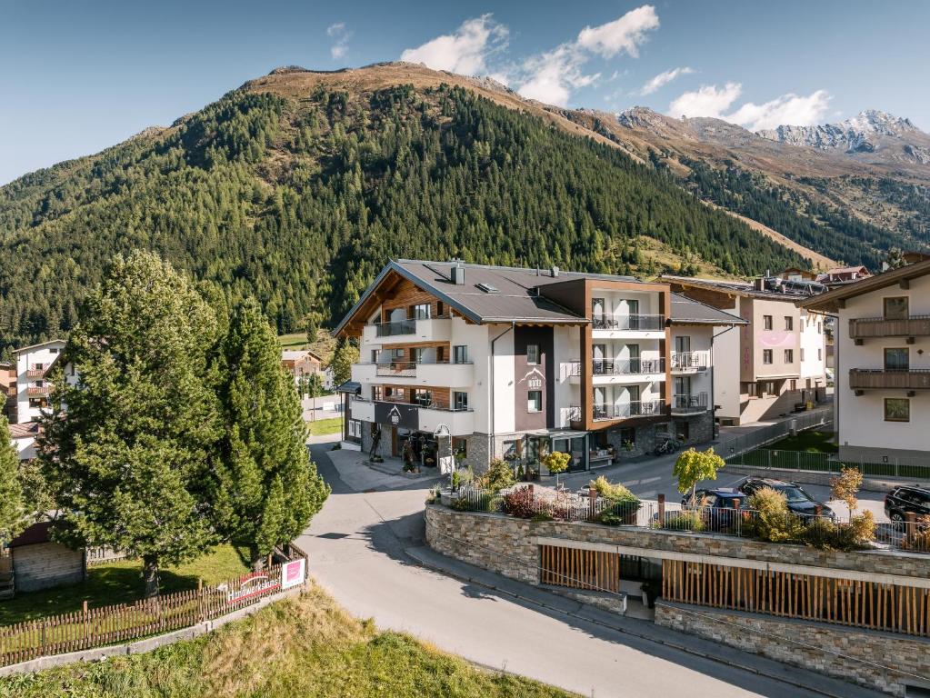an aerial view of a town with a mountain at Alpinhotel Monte Superior - Silvretta Card Premium Betrieb in Galtür