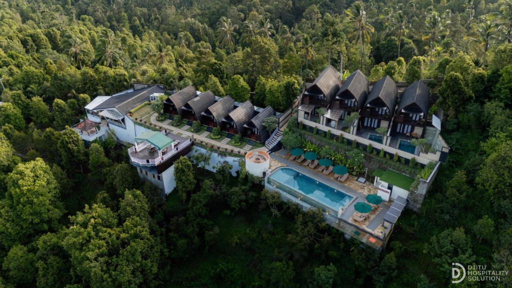 an aerial view of a mansion in the forest at Munduk Kupang Sekumpul Villa in Singaraja