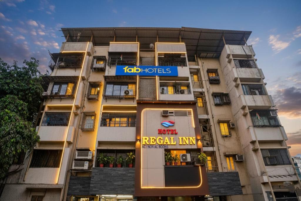a building with a rental inn sign on it at FabHotel Regal Inn - In Sahar Road in Mumbai