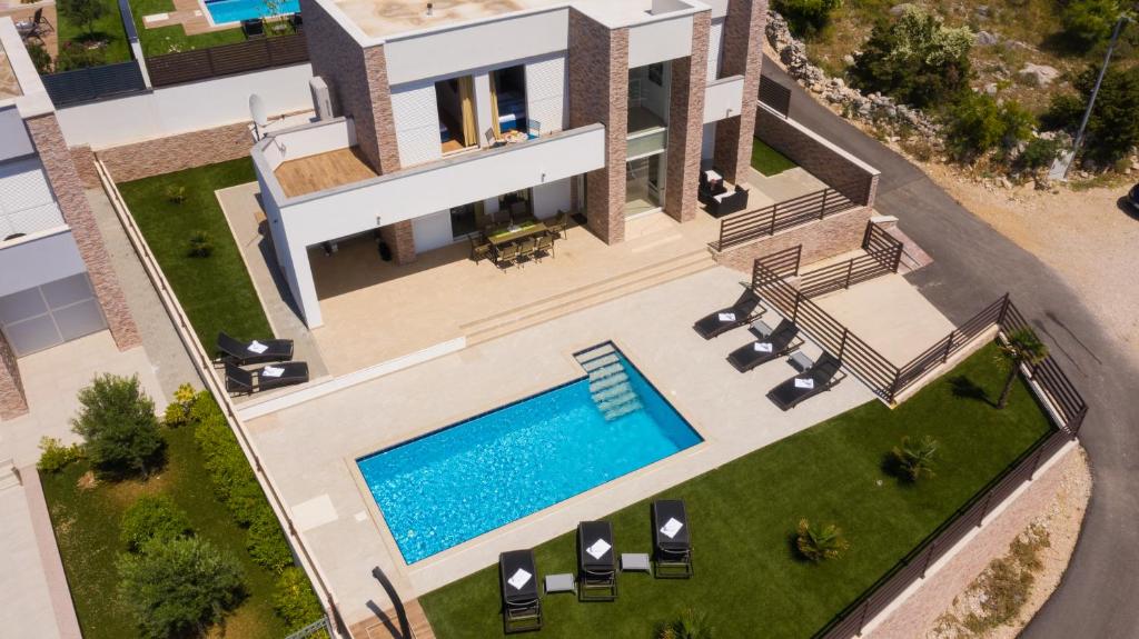 an aerial view of a villa with a swimming pool at Villas Royal III in Novalja