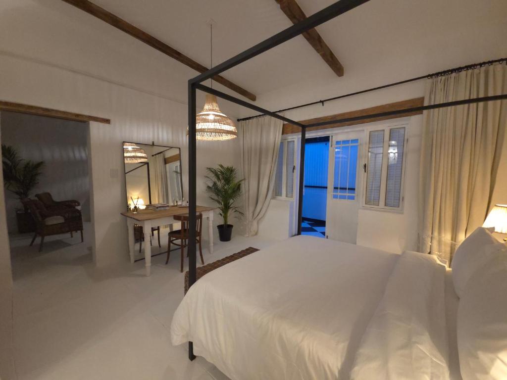 a bedroom with a bed and a table and a mirror at Stay at Richmond in Richmond