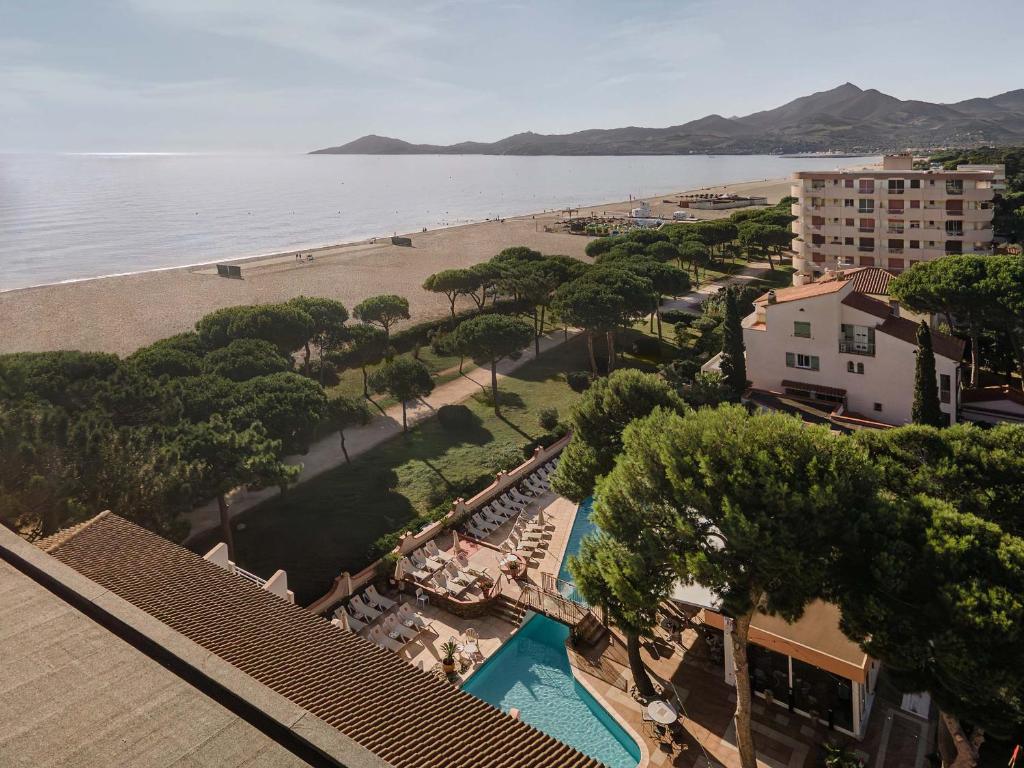 an aerial view of a beach and a resort at Grand Hôtel Du Lido in Argelès-sur-Mer