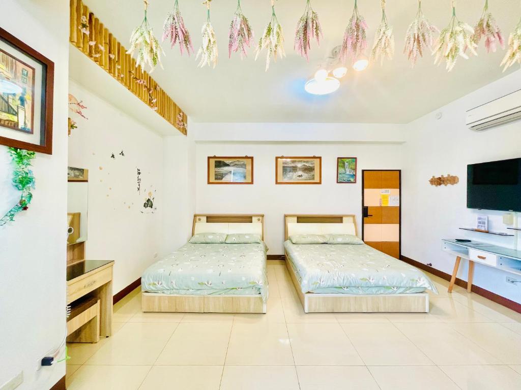 Una cama o camas en una habitación de Lohas-artist B&B