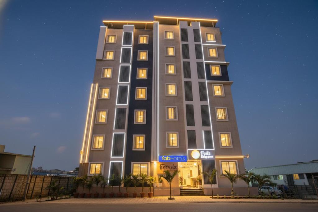 a tall building with lights on at FabHotel Frendz - Nr Hitech City Metro Station in Jāmb