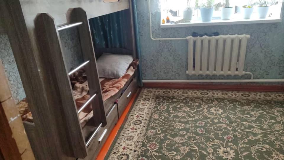 a room with two bunk beds and a window at Гостевой дом Жылдыз Курак in Orto-Saz