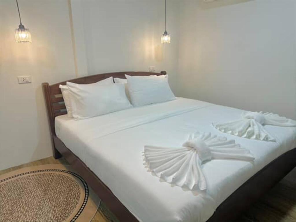 Voodi või voodid majutusasutuse Rungarun Residence toas