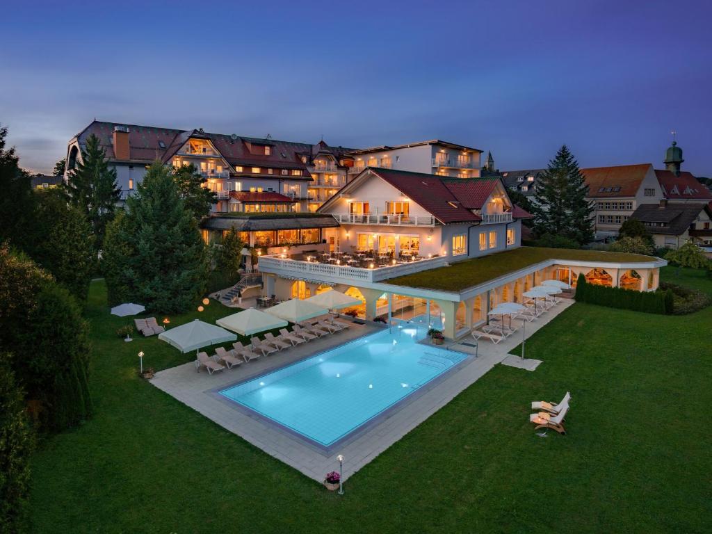 an aerial view of a large house with a swimming pool at Möhringers Schwarzwald Hotel in Bonndorf im Schwarzwald