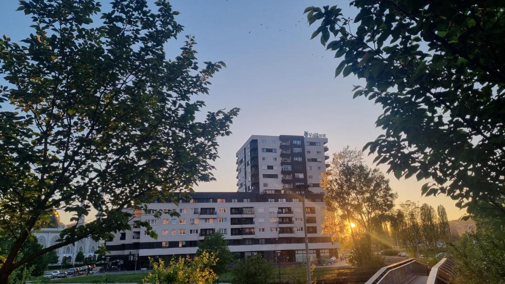 a tall building in the middle of a city at Apartman IsTar View in Sarajevo