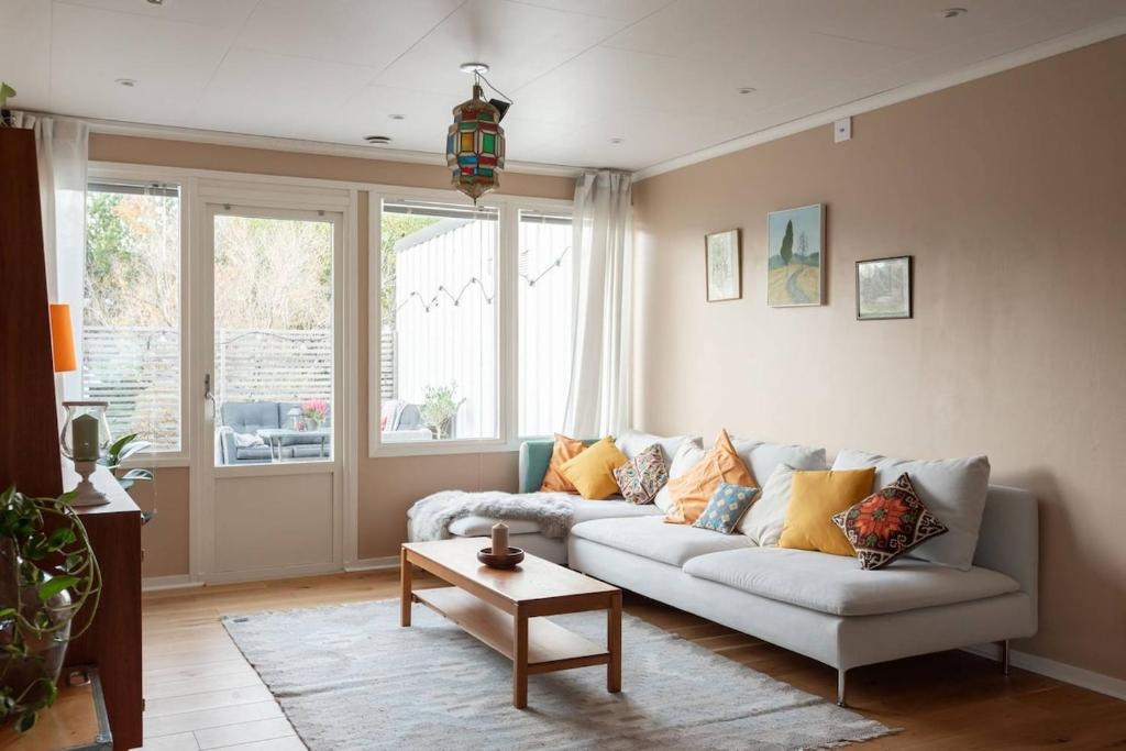 a living room with a couch and a table at Home in Vingåker in Vingåker