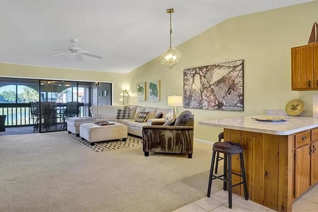 a living room with a couch and a table at Perfect blend of comfort Lake Wales in Lake Wales