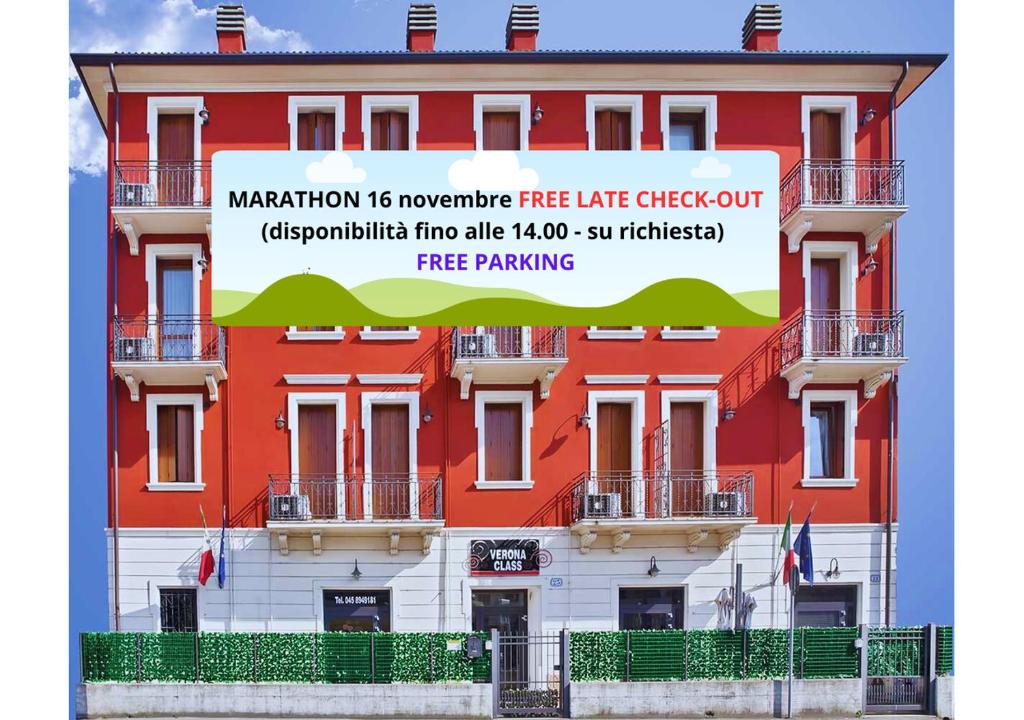 a building with a sign on the side of it at Verona Class ApartHotel "Residenze del Cuore" in Verona