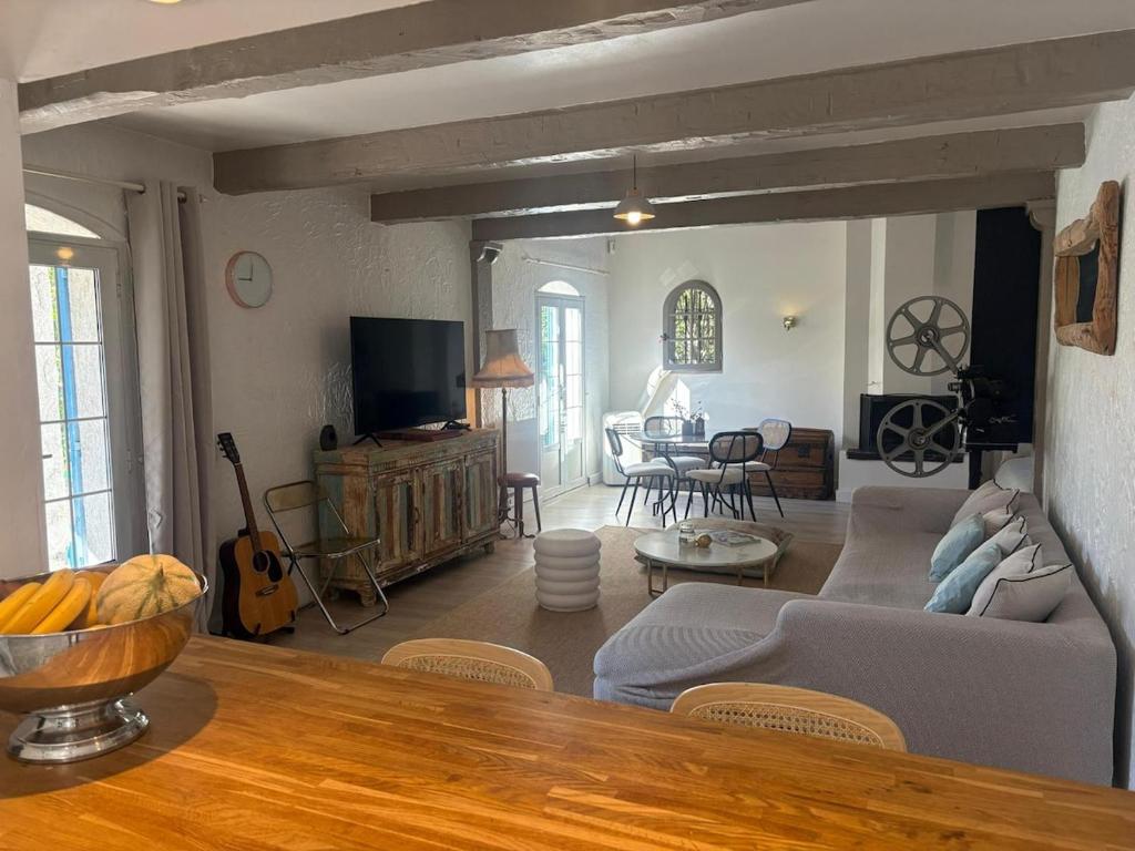 a living room with a couch and a table at 3 Bedroom 2 Bath Villa Private Pool in Mougins in Mougins