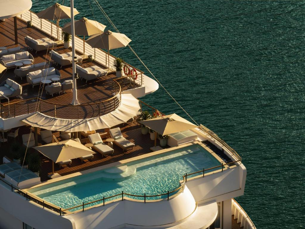 a cruise ship with a swimming pool on the water at Bhaya Soul Cruise in Ha Long