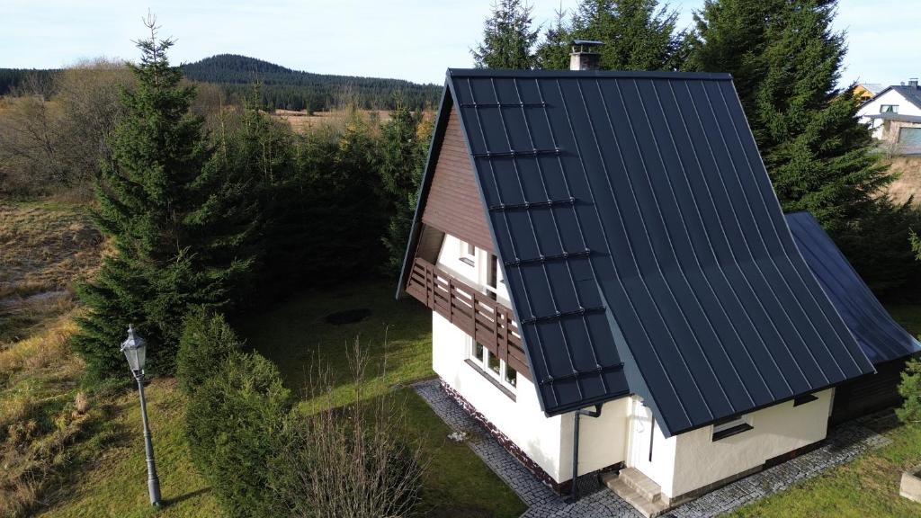 an overhead view of a house with black roof at Chata Kulík in Boží Dar