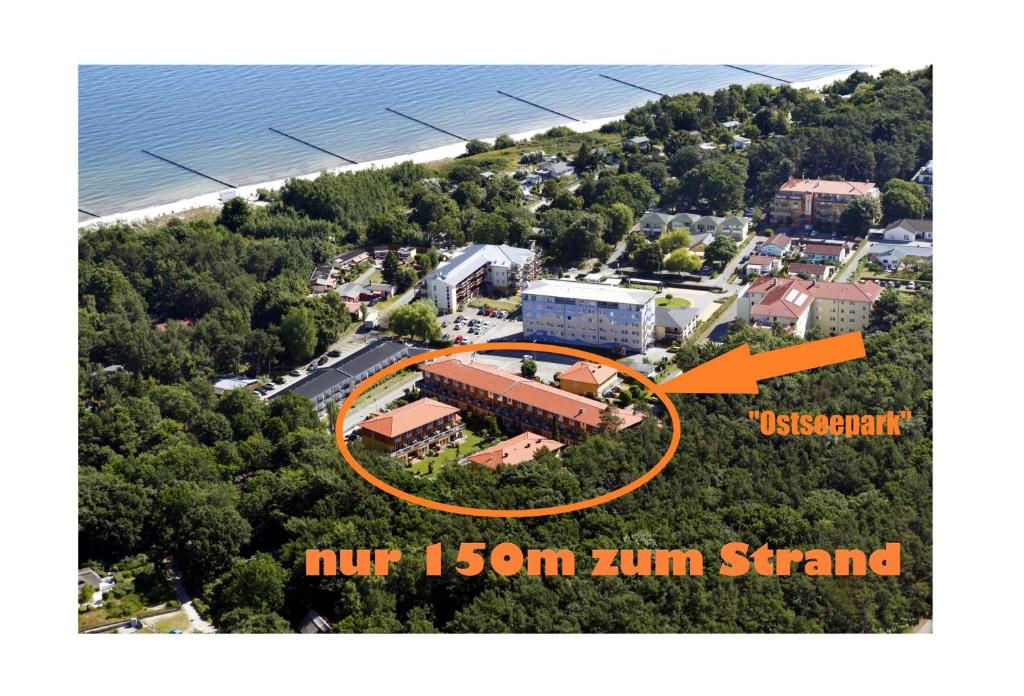 an aerial view of a building with an orange arrow pointing to a building at Ostseepark in Zempin