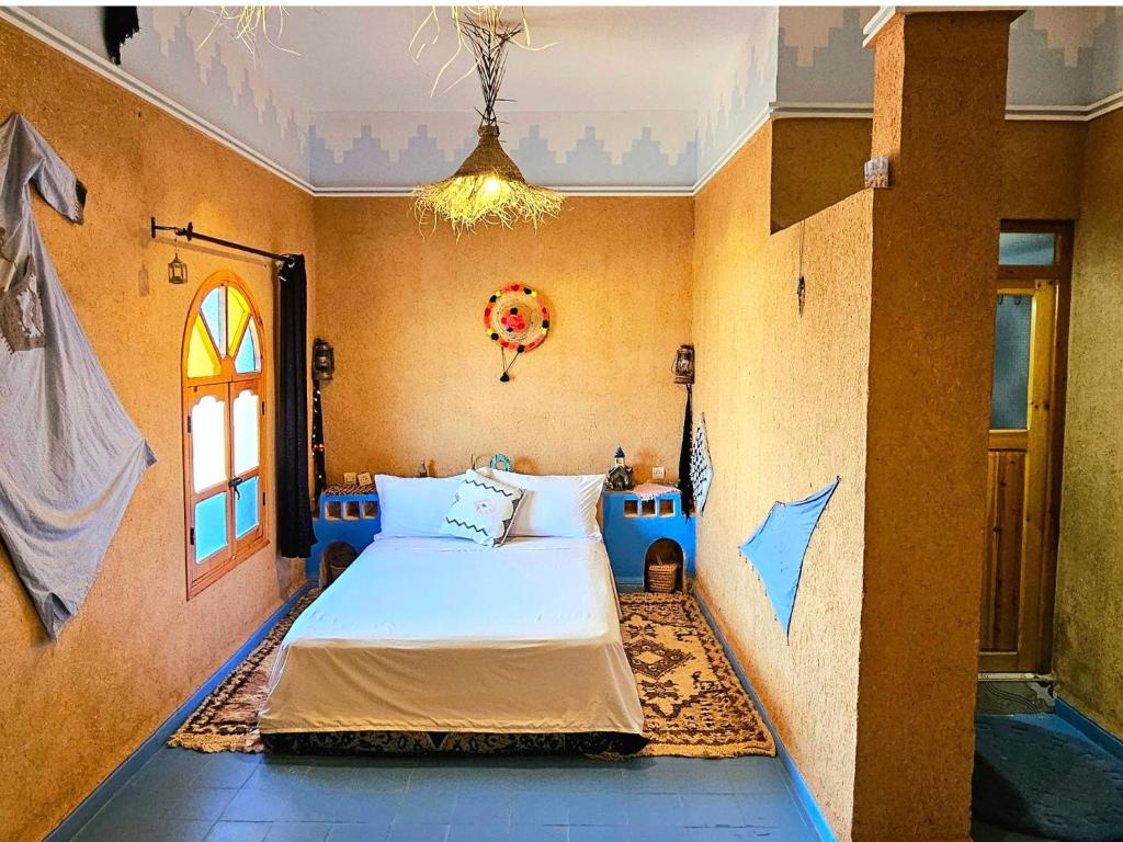 Ένα ή περισσότερα κρεβάτια σε δωμάτιο στο Kasbah of Peace Draa Valley