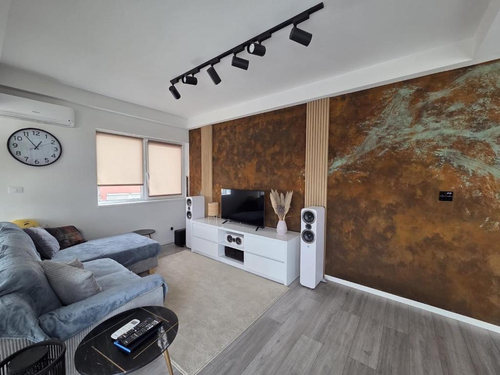 Μια τηλεόραση ή/και κέντρο ψυχαγωγίας στο Penthouse-Style Flat with Large Terrace