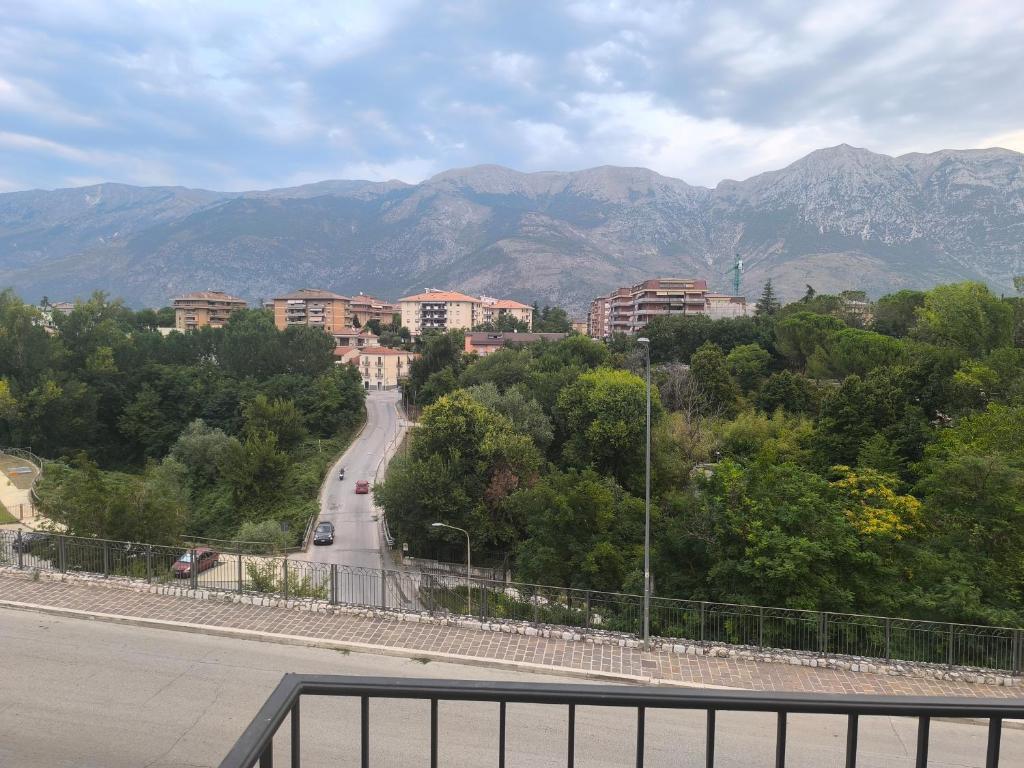 a view of a road with mountains in the background at L'angolino di Ale in Sulmona