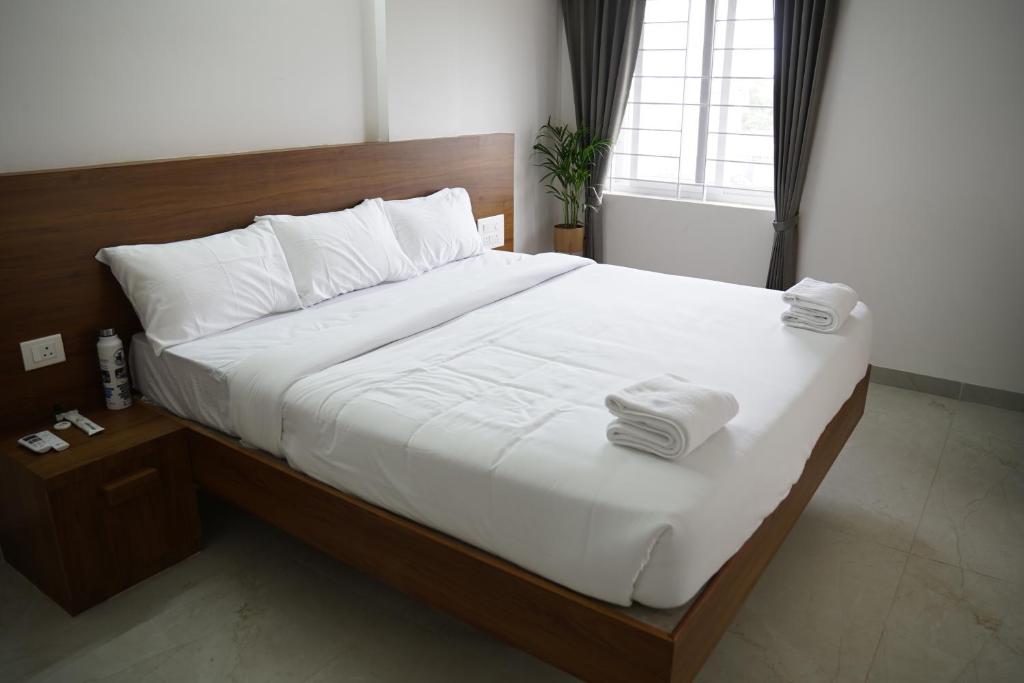 Ένα ή περισσότερα κρεβάτια σε δωμάτιο στο KK Service