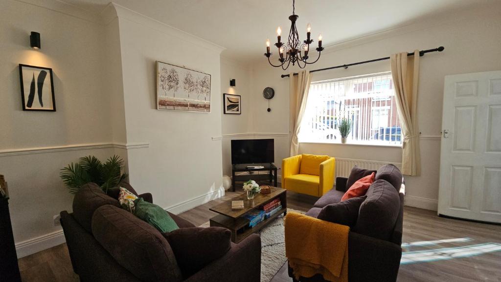 a living room with two couches and a tv at Ushaw HillTop View in Ushaw Moor