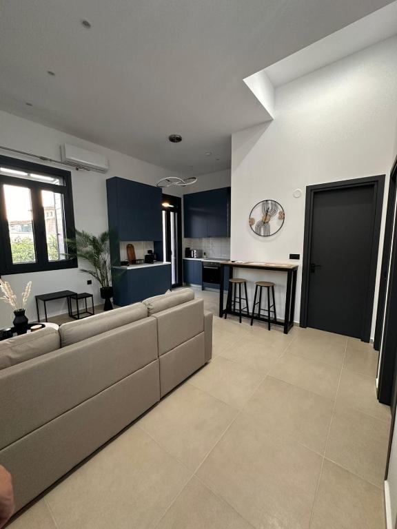 a living room with a couch and a table at Helios 2 in Chios