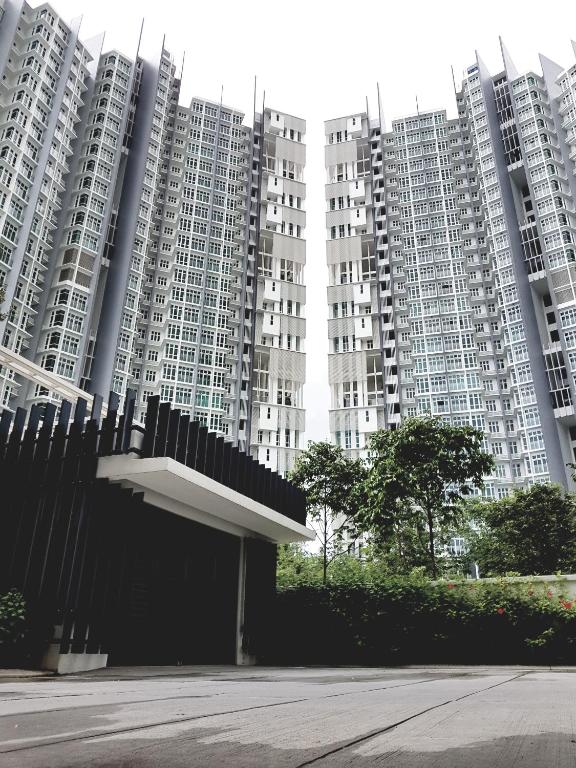 a group of tall white apartment buildings at Holi 1Medini Themed Suites in Nusajaya